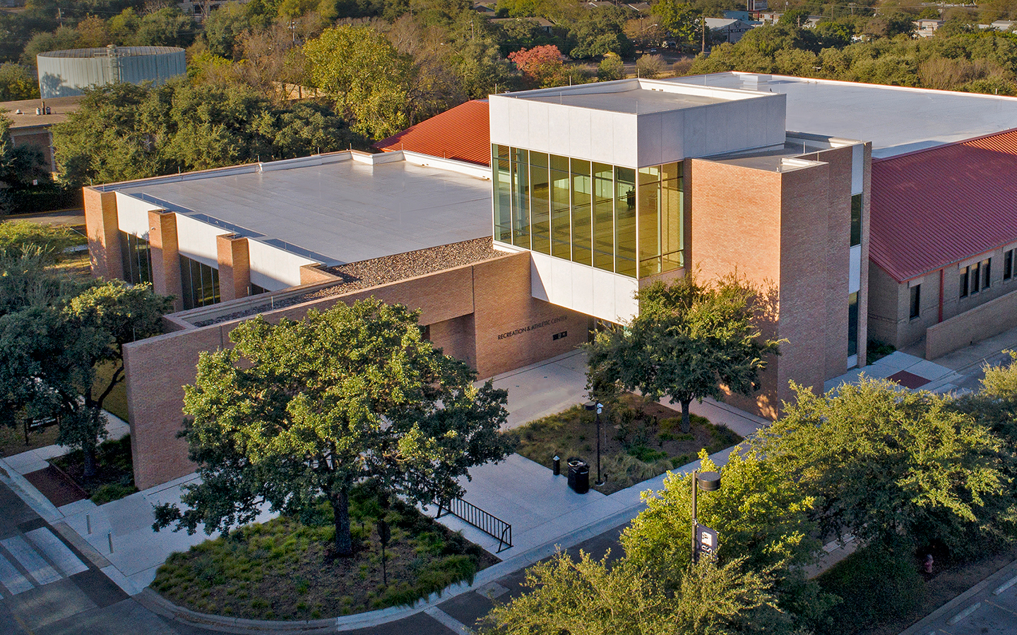 Birds eye view of Recreation and Athletic Center by Specht Novak Architects to showcase the new addition complementing the existing structure behind. Shot by Andrea Calo.