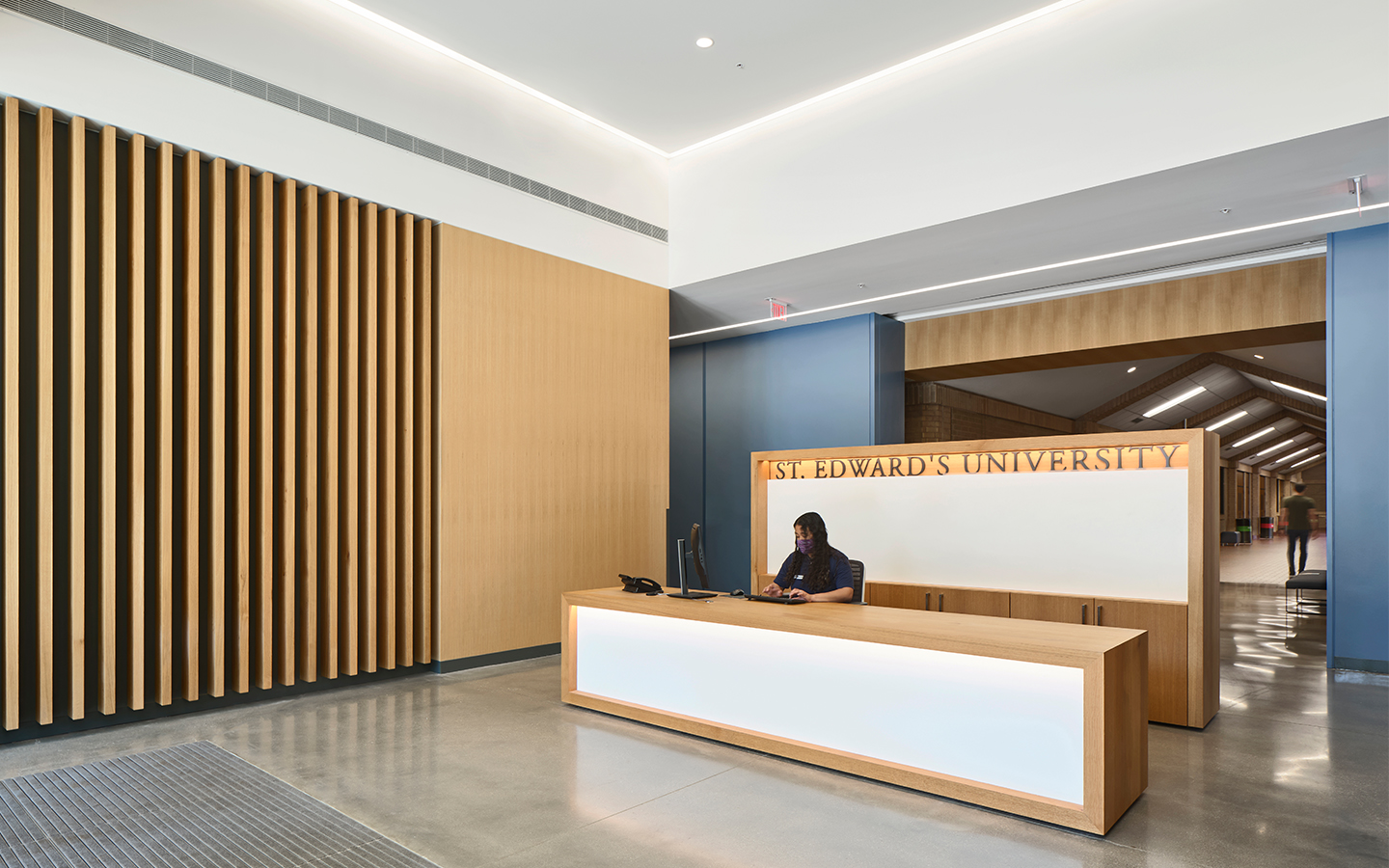 Reception desk of Recreation and Athletic Center by Specht Novak Architects. Shot by Andrea Calo.