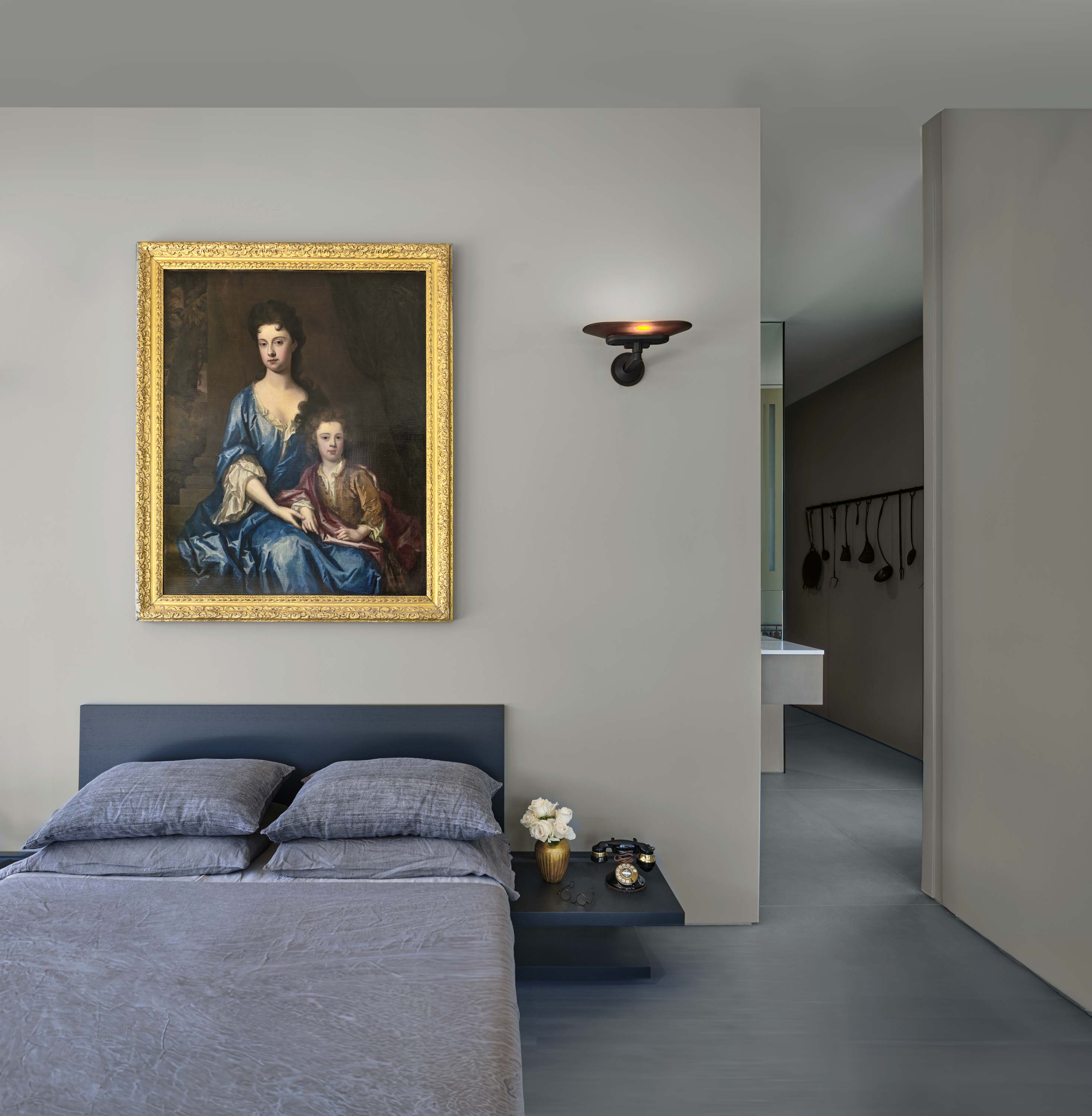 Interior photo of the Casa Annunziata Residence by Specht Novak Architects. Shot by Dror Baldinger, featuring a hallway into a children's bedroom with modern furniture that appears to float.