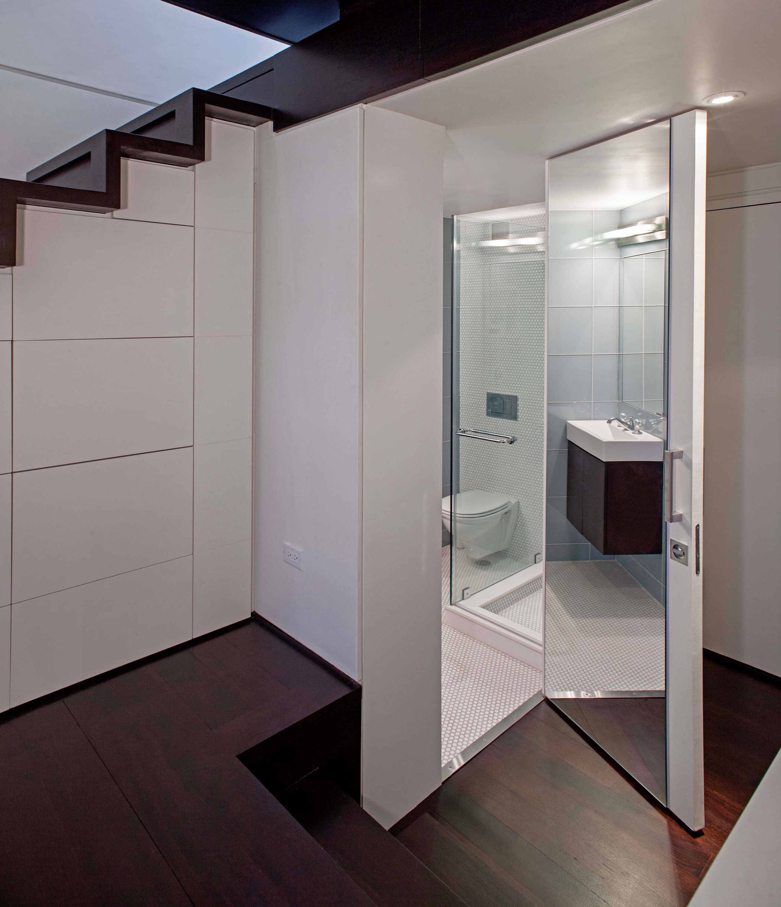 Entrance into bathroom of Manhattan Microloft by Specht Novak Architects, shot by Taggart Sorensen.