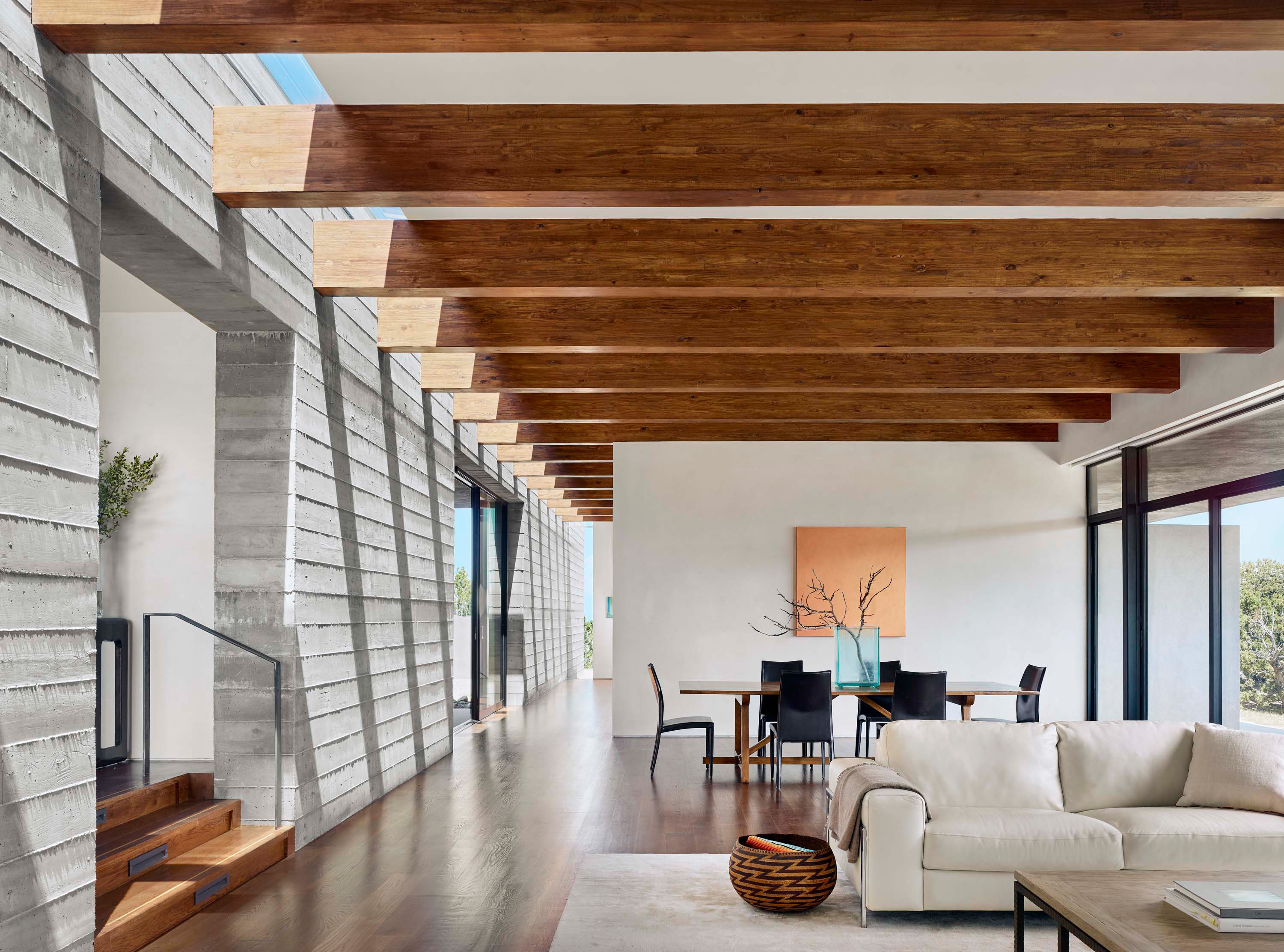 Interior photo of the Sangre de Cristo House by Specht Novak Architects. Shot by Casey Dunn, featuring bright living and dining areas with beamed ceilings.